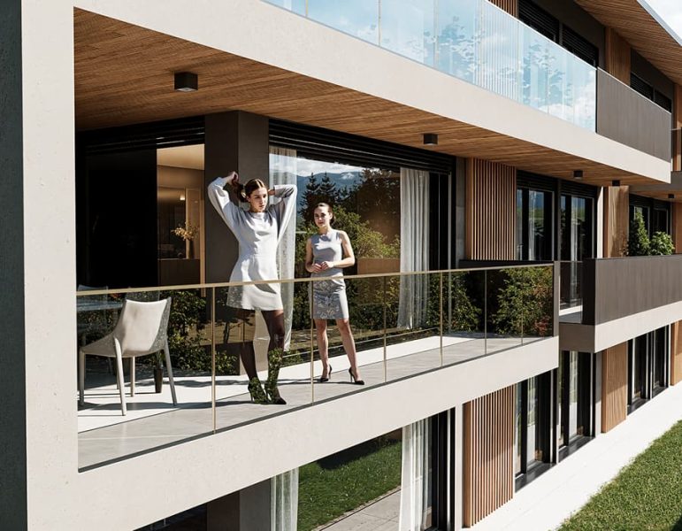 Due persone su un balcone di un condominio moderno, una in maglia bianca e stivali, l'altra con vestito corto, godono una vista esterna.